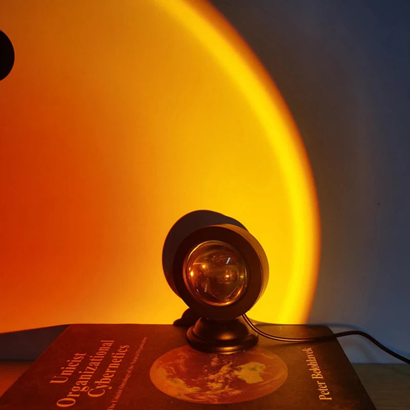 Sunset lamp projecting a golden glow on a wall