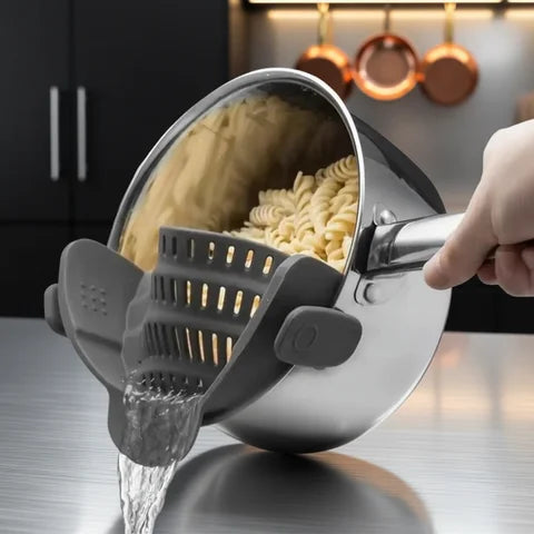 Silicone clip-on strainer draining noodles in a modern kitchen