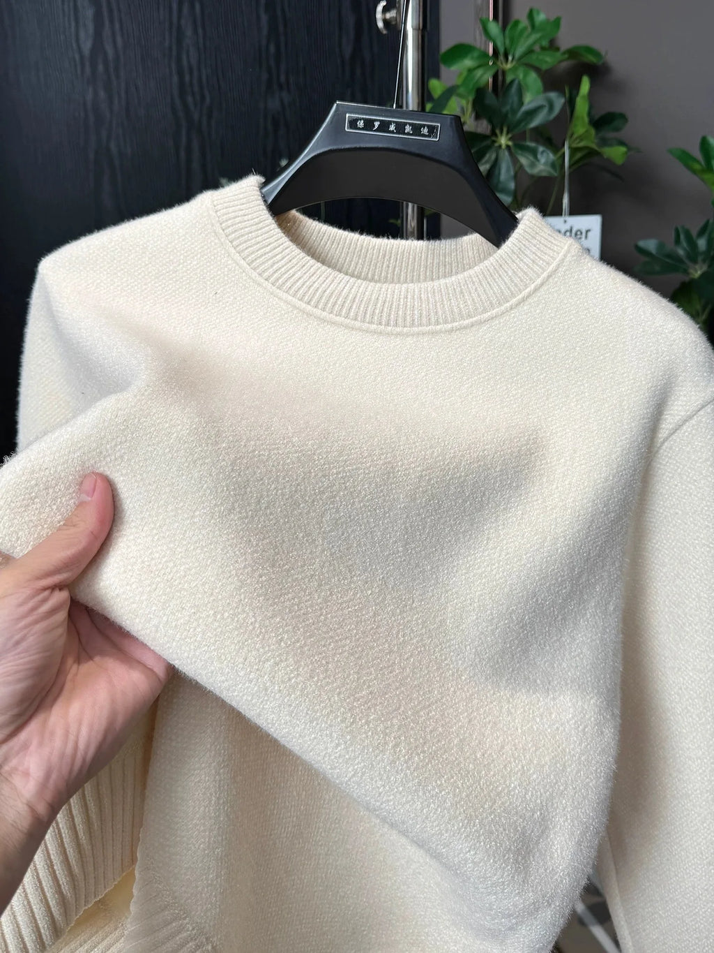 Round-neck knit sweater on model