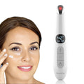 3-in-1 under-eye massager wand with cooling metal tip, in use on face